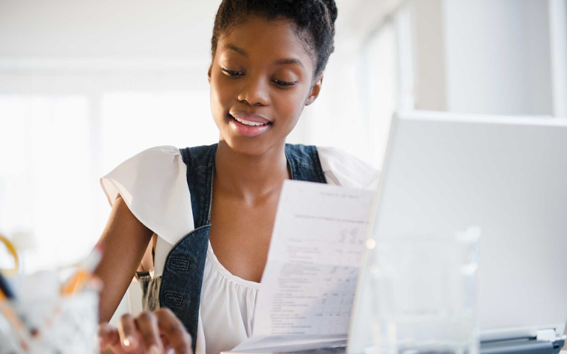 woman using The Police Credit Union's financial calculator to make financial decision 